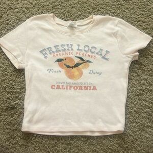 light orange peaches graphic crop tee